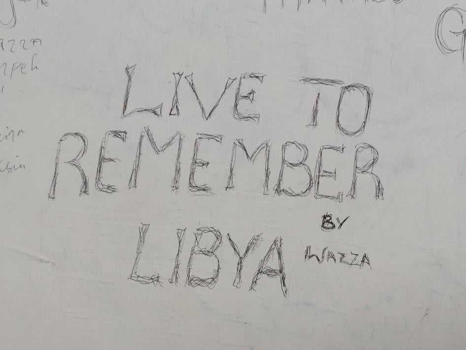 Graffiti by migrants at the Pozzallo reception center on Sicily, Italy.