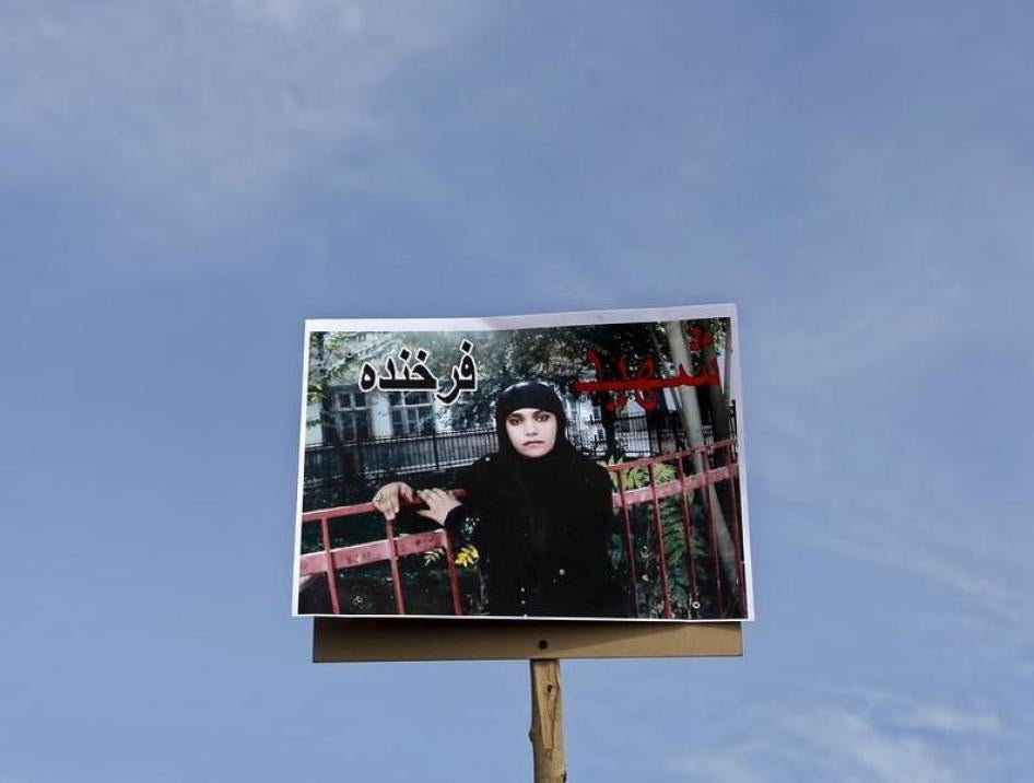 A picture of Farkhunda, an Afghan woman who was beaten to death and set alight on fire on Thursday, is seen during her funeral ceremony in Kabul March 22, 2015.