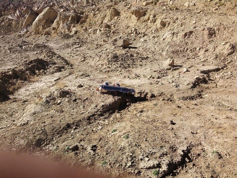 A BLU-108 canister with two skeet (submunitions) still attached lies where it fell, in one of the tracks of the quarry at the in Amran Cement Factory, during the February 15, 2016 attack. 