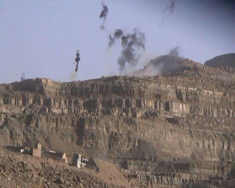 A still taken from a video made by a Yemen Today photographer recorded from the roof of a house in al-Darb village of an attack using CBU-105 Sensor Fuzed Weapons near a quarry of the Amran Cement Factory on February 15, 2016.