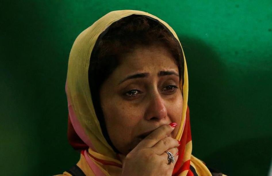A relative cries after attending the funeral prayer of the victims who were killed in the attack on the Holey Artisan Bakery and the O'Kitchen Restaurant, in Dhaka, Bangladesh, July 4, 2016. 