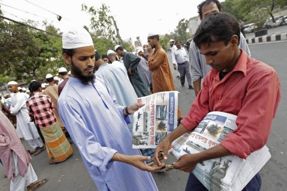 A man buys a local newspaper in Dhaka, Bangladesh on March 20, 2011.