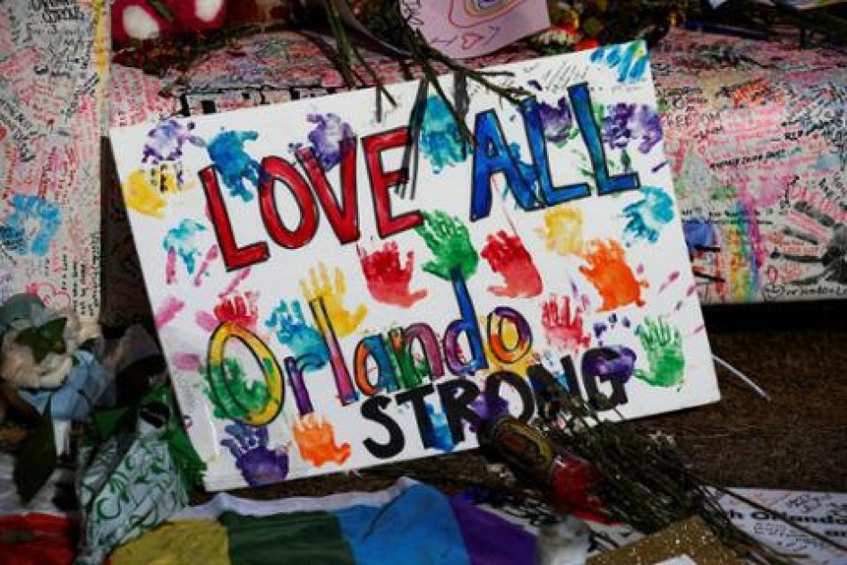 A sign of support is pictured at a memorial for the victims of the mass shooting at the Pulse nightclub in Orlando, Florida. ©2016 Reuters.