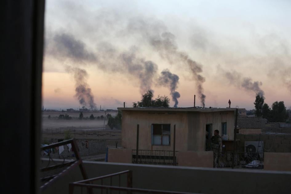 Smoke rises from clashes during a battle with Islamic State militants southeast of Mosul, Iraq on November 3, 2016. 