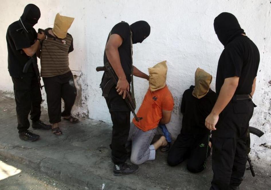 In Gaza, fighters from Hamas’s armed wing prepare to execute men accused of collaborating with Israel during the 2014 war.