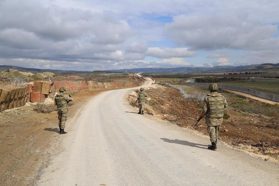 Turkish soldiers patrol in Hatay province along Turkey's new border wall with Syria in February 2016.