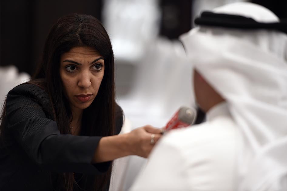 Bahraini journalist Nazeeha Saeed conducts an interview in Manama, Bahrain, August 26, 2014.