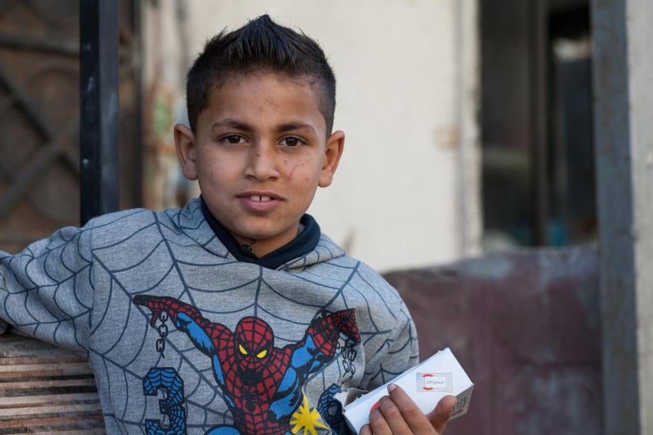 Nizar, 10, sells gum on the street every day because his family can’t afford to send him to school or lose his income. 