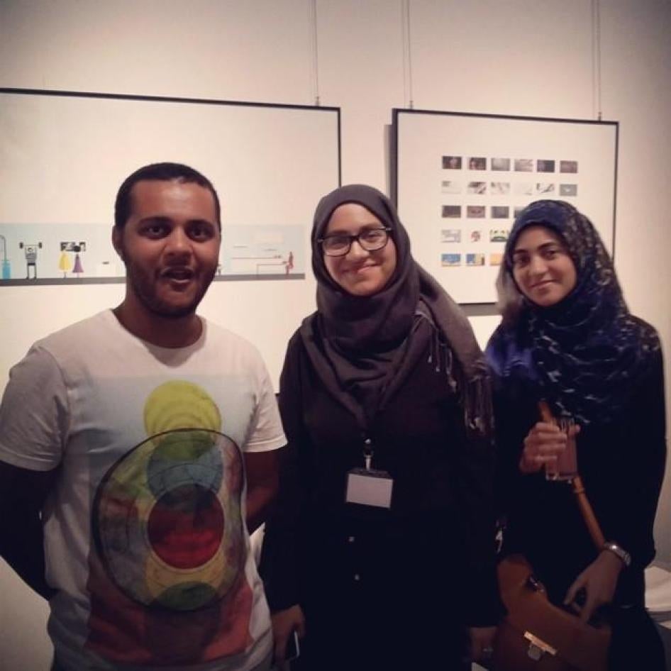Mosaab Abd el Aziz and his sisters Yara and Arwa at a graduation exhibition in 2014.  