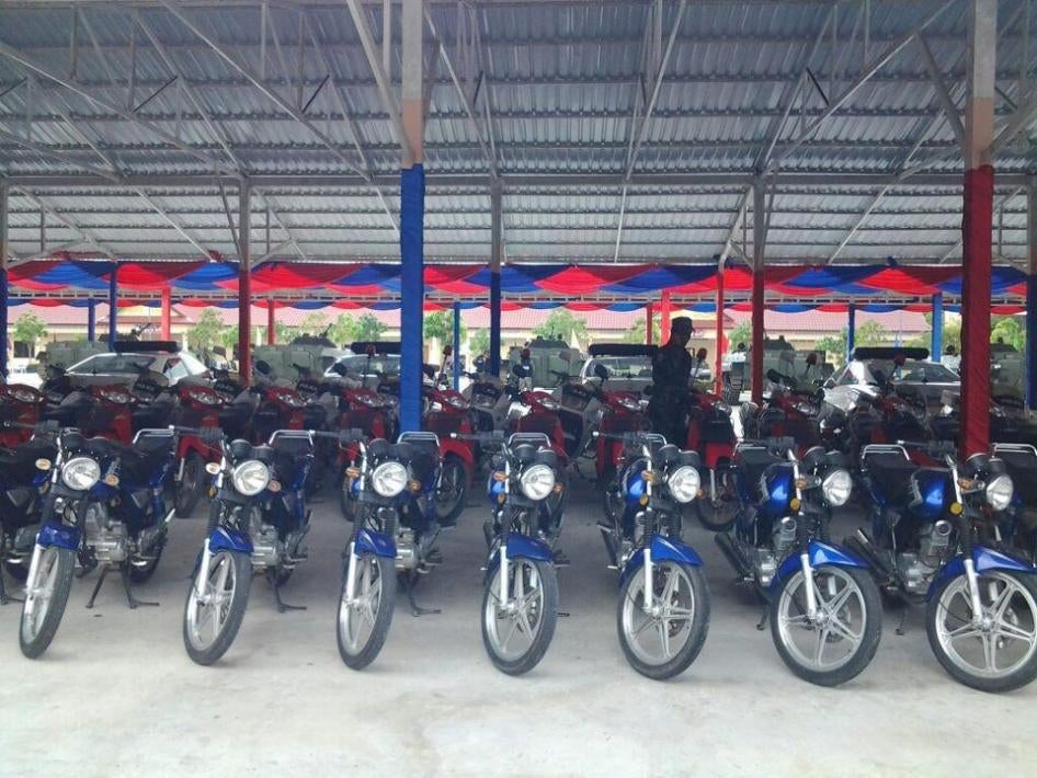 BHQ vehicles, including red Suzuki motorcycles, in a BHQ motor pool. Source: human rights monitors’ collection from social media.