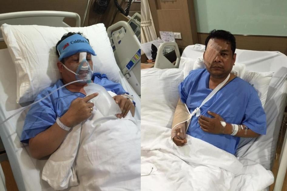 Deux membres du Parti du sauvetage national du Cambodge, Kung Sophea et Nhay Chamraoen, photographiés dans un hôpital de Bangkok le 29 octobre 2015, trois jours après  avoir  été violemment agressés devant le siège de  l'Assemblée nationale du Cambodge à 