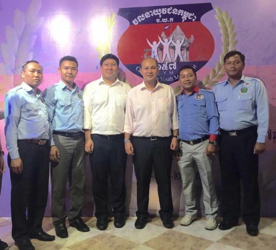 Dieng Saran (far left) with Hun Many (third from right) in front of the Cambodian Youth Movement logo. Source: human rights monitors’ collection from social media.