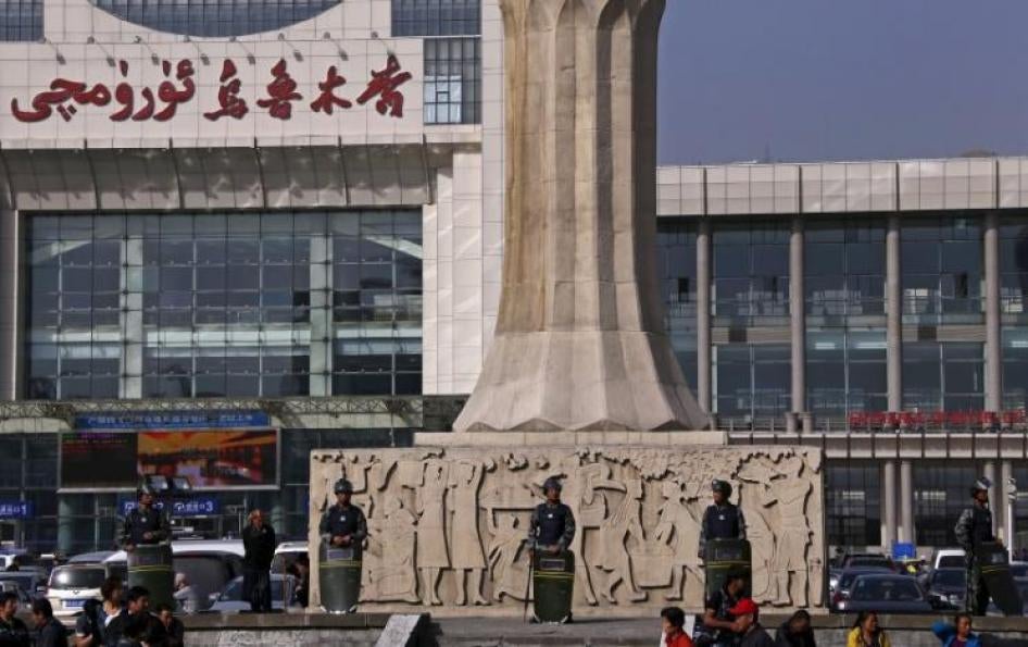Police stand outside the South Railway Station in Urumqi, Xinjiang Uighur Autonomous Region on May 2, 2014. 