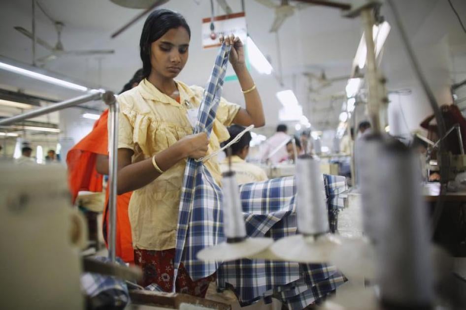 An employee works in a factory of Babylon Garments in Dhaka January 3, 2014.