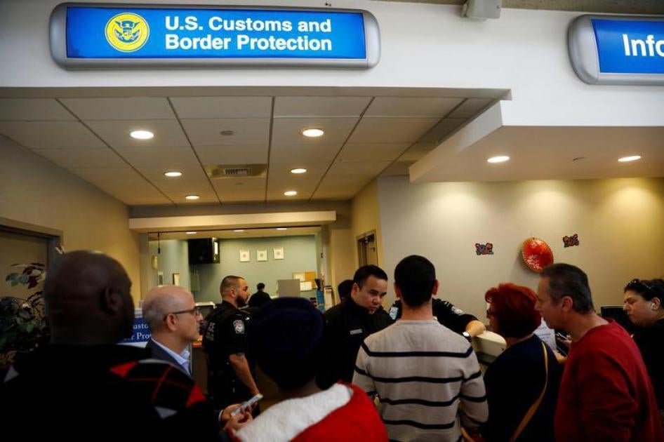 U.S. Customs and Border Protection officers stand outside an office during the travel ban at Los Angeles International Airport (LAX) in Los Angeles, California, U.S., January 28, 2017.
