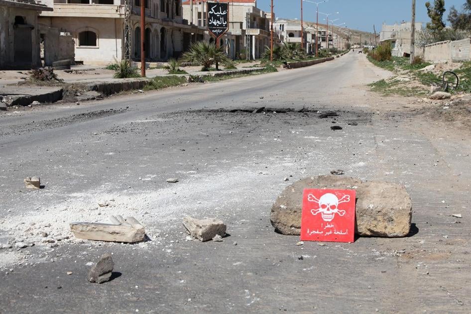 A poison hazard danger sign is seen in the town of Khan Sheikhoun, Idlib province, Syria on April 5, 2017. © 2017 Abdussamed Dagul/Anadolu Agency/Getty Images