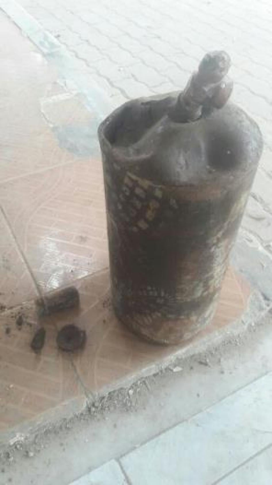 Deformed gas cylinder that a Syria Civil Defense member said was found at the site of a March 29 attack in the Qaboun neighborhood in eastern Damascus, which is controlled by armed groups fighting the government.