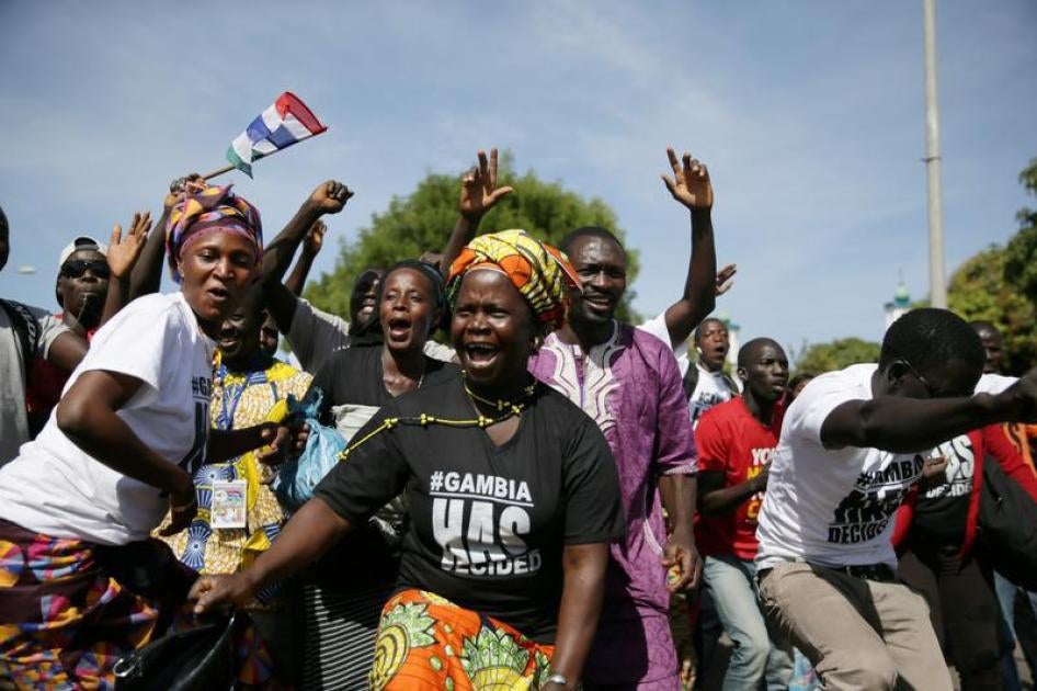 Supporters of Gambian President Adama Barrow, who was inaugurated at the Gambian Embassy in neighbouring Senegal, gather to receive him as he arrives from Dakar, in Banjul, Gambia January 26, 2017.