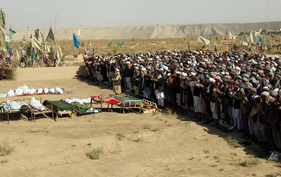 Afghans attend a funeral for those killed by an airstrike during a raid on suspected Taliban forces in Kunduz on November 4, 2016.
