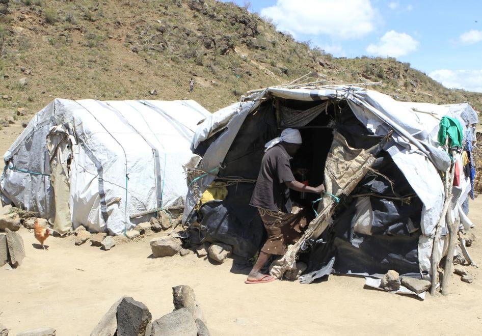 A woman displaced in the violence following the 2007 elections enters a makeshift shelter at the camp for internally displaced people in Naivasha October 8, 2014.
