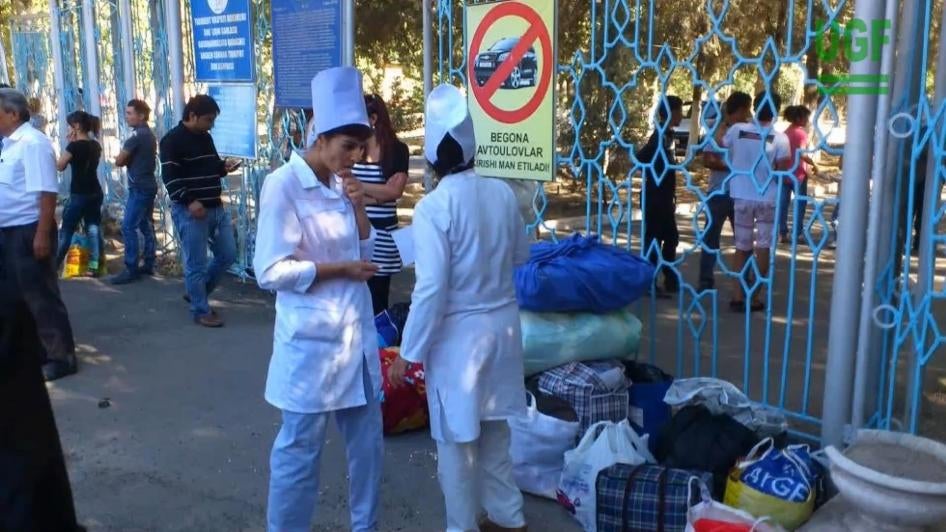 Nurses from the Angren city hospital, Tashkent region, gathered with their belongings awaiting transport to the cotton fields during the 2015 cotton harvest.