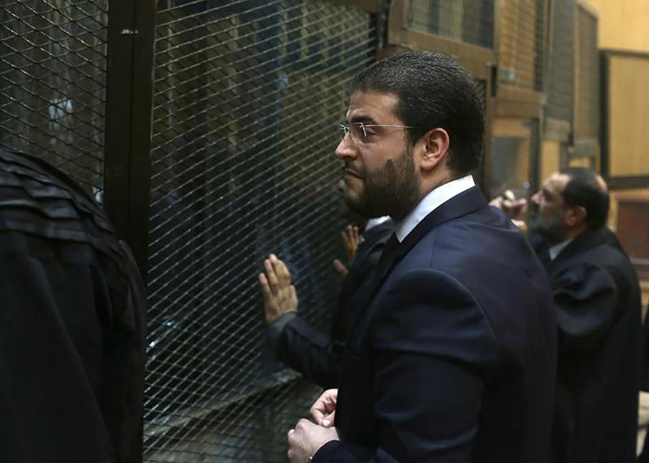 Osama Mohamed Morsy, son of Egypt's ousted president Mohamed Morsy, talks to Muslim Brotherhood members before their trial in a court on the outskirts of Cairo in December 2014. Osama was later arrested and sent to prison. Former President Morsy’s family 