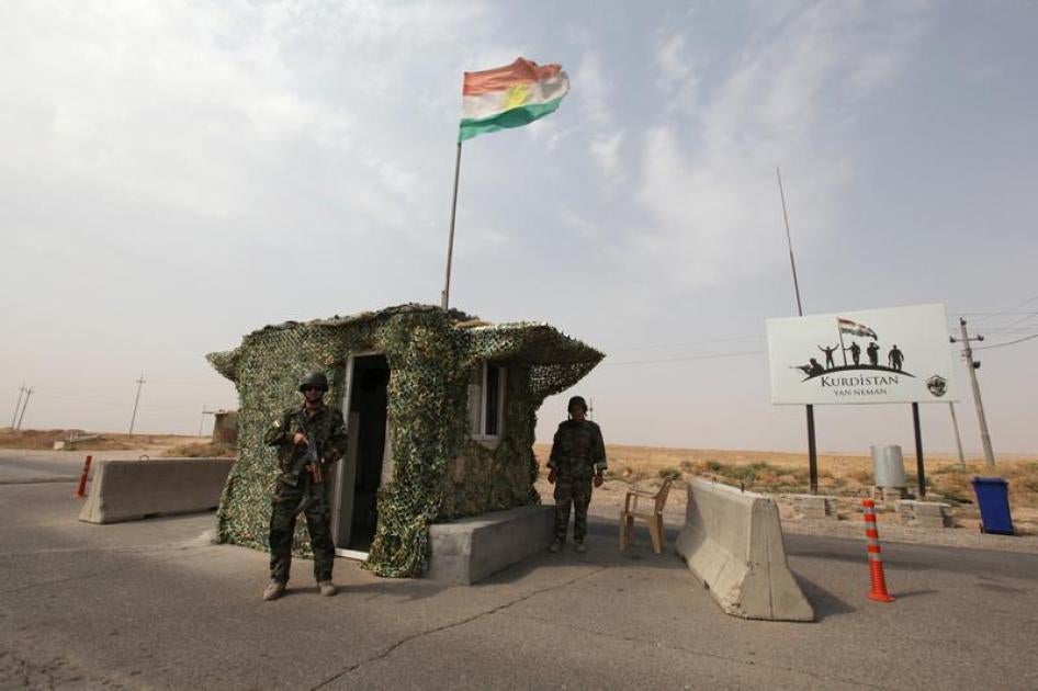 Peshmerga forces stand guard at a checkpoint in northern Iraq. 