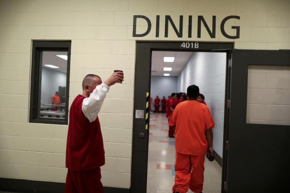 ICE detainees walk into the dining area for lunch at the Adelanto immigration detention center, which is run by the Geo Group Inc (GEO.N), in Adelanto, California.