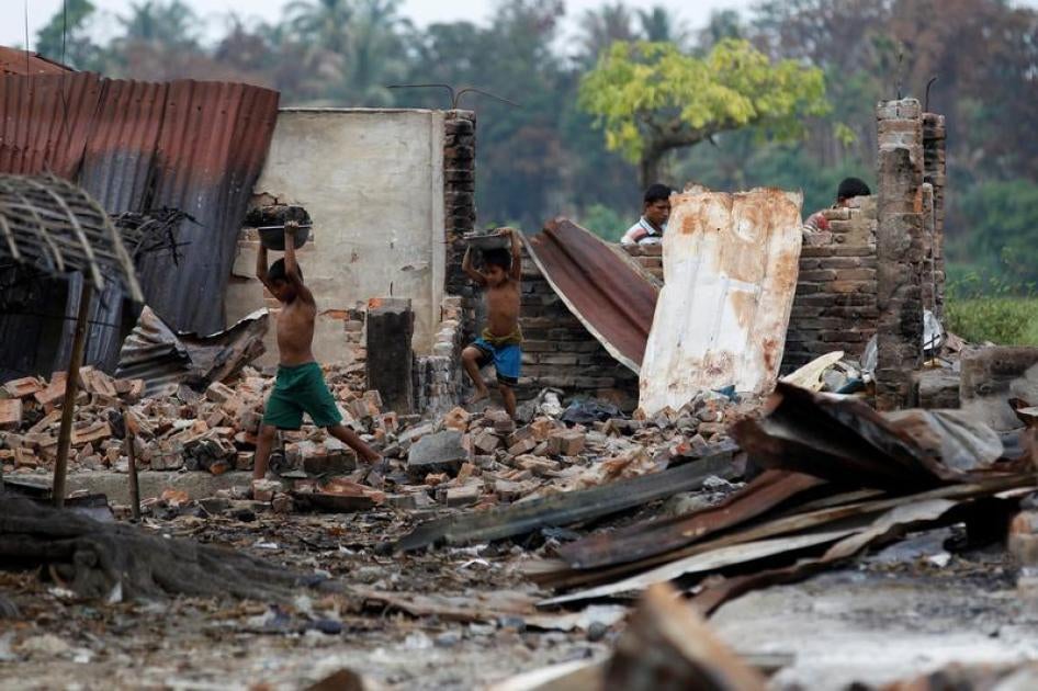 Children recycle goods from the ruins of a market which was set on fire at a Rohingya village outside Maungdaw in Rakhine state, Myanmar, October 27, 2016.