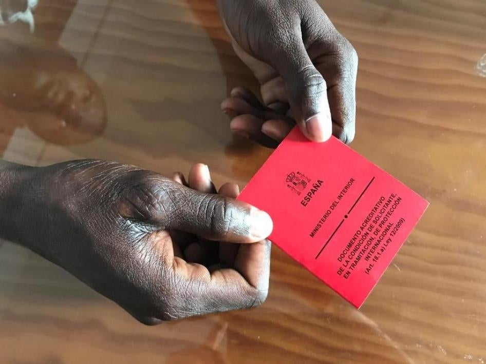 “Oumar,” a 24-year-old from Mali, holds his asylum seeker card. Oumar had no opportunity to apply for asylum upon disembarkation in Algeciras, and was only able to do so when remanded to the Tarifa immigration detention center. He was released ten days la