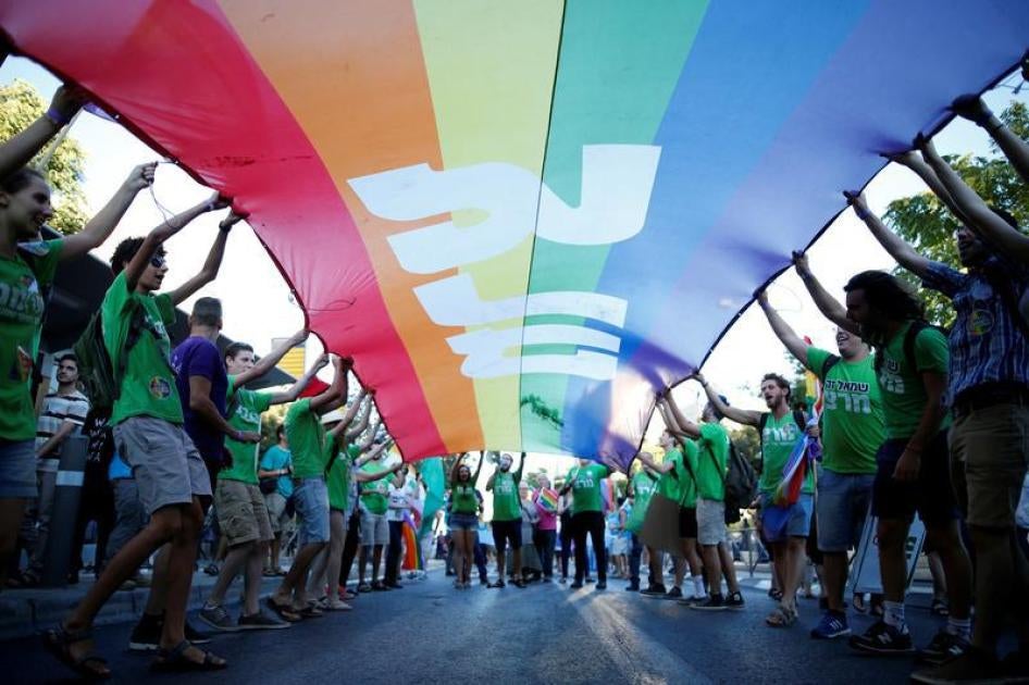 Participants take part in the annual Gay Pride parade in Jerusalem July 21, 2016.