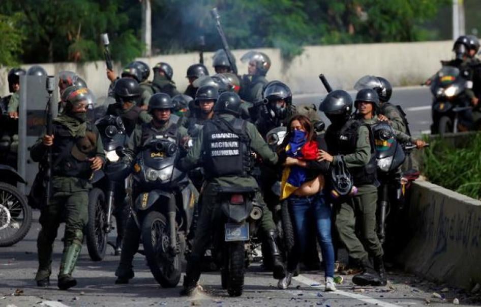 A demonstrator is detained by security forces during clashes at a protest against Venezuelan President Nicolas Maduro's government in Caracas, Venezuela, July 10, 2017. 