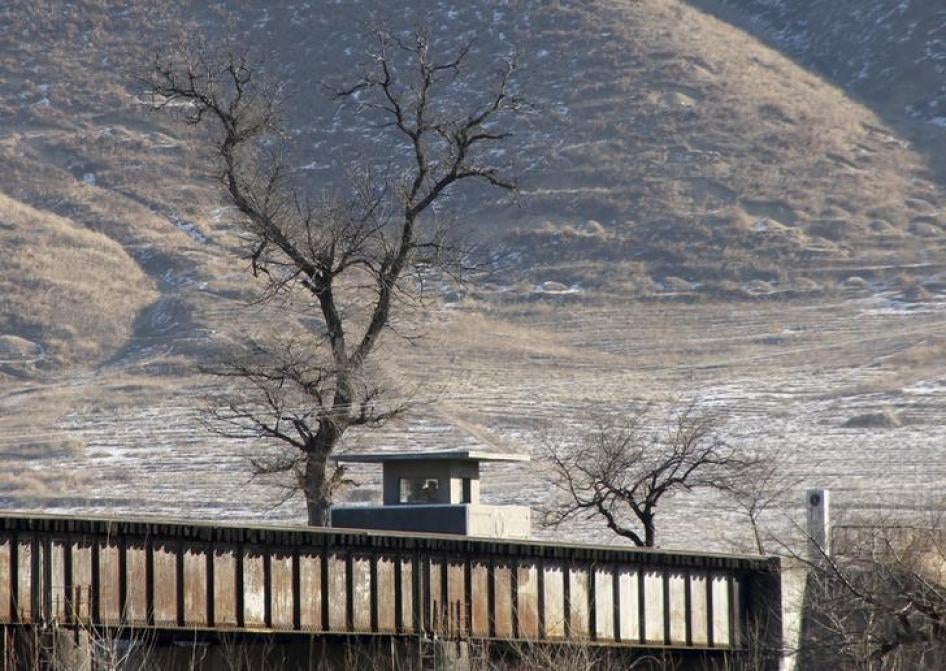 North Korean soldiers in a border guard post are seen from the Chinese side in Tumen, China, January 7, 2016. 