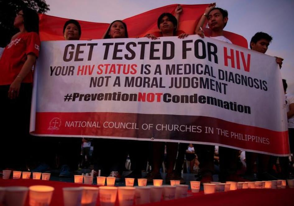 Campaign supporters hold a banner during a commemoration event on International AIDS Candlelight Memorial Day in Quezon City, Metro Manila, Philippines, May 14, 2016.