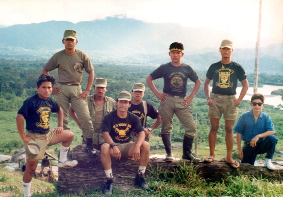 Photograph of Ollanta Humala Tasso (sitting in the front) and other soldiers, wearing a T-shirt with the "Madre Mía" base name on it, taken in the early 1990s. 