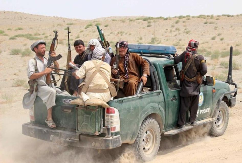 Afghan local police (ALP) sit at the back of a truck near a frontline during a battle with the Taliban at Qalay- i-zal district, in Kunduz province, Afghanistan August 1, 2015.