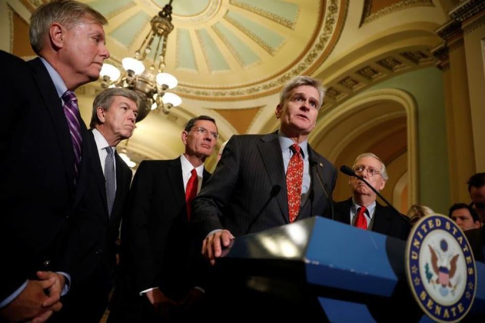 Sen. Bill Cassidy (R-LA), accompanied by Sen. Lindsey Graham (R-SC), Sen. Roy Blunt (R-MO), Sen. John Barrasso (R-WY) and Senate Majority Leader Mitch McConnell, speaks with reporters following the party luncheons on Capitol Hill in Washington, U.S., Sept
