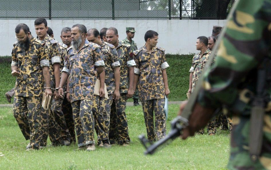 Members of the Bangladesh Rifles (BDR) are summoned for a hearing before a special court in Dhaka, July 12, 2010. 
