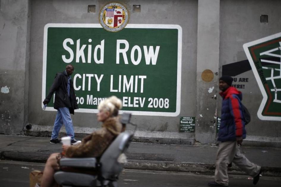 People view a memorial for a man killed by police on skid row in Los Angeles, California, March 2, 2015.