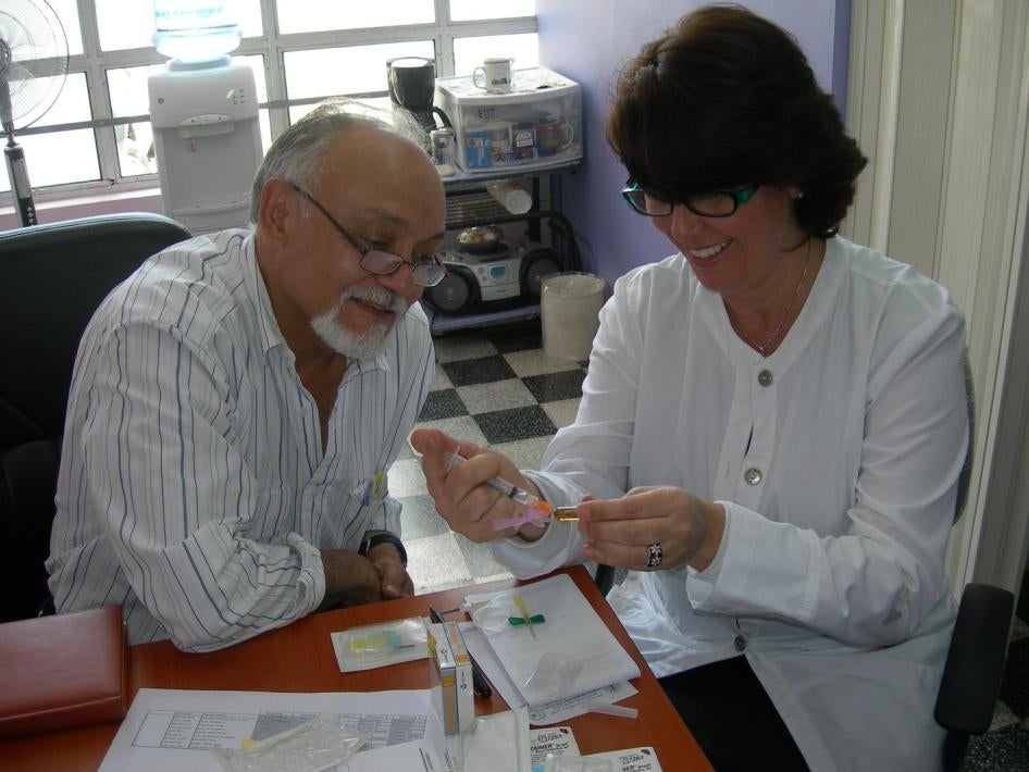 Dr. Eva Duarte and a colleague, Dr. Castro, at the National Cancer Institute