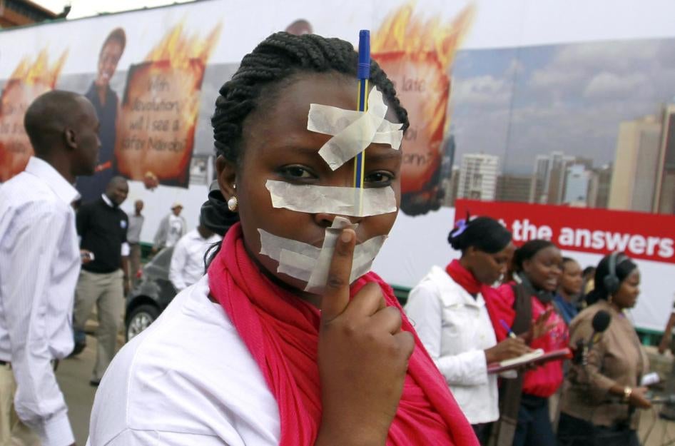A Kenyan journalist participates in a protest in the capital, Nairobi, against draconian new laws restricting media freedom that were presented in parliament, December 3, 2013. 