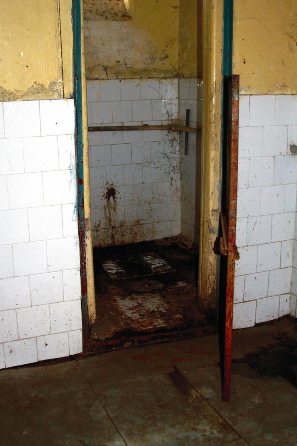 A toilet in Pune Mental Hospital, India. With only 25 working toilets for 1,850 patients, open defecation was the norm when Human Rights Watch visited in 2013 prior to renovations to its sanitation system. 
