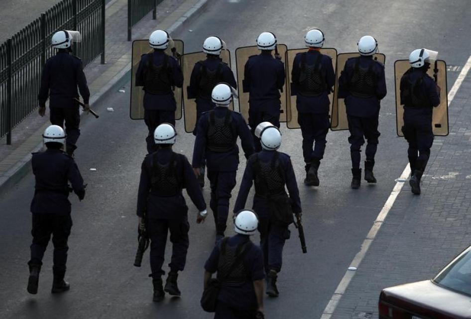 Riot police confront protesters in a village south of Manama on November 24, 2011, the day after King Hamad accepted the findings of the Bahrain International Commission of Inquiry (BICI) that the Interior Ministry and the National Security Agency engaged