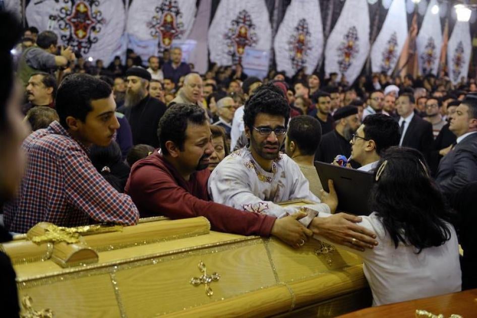 Relatives of victims react next to coffins arriving to the Coptic church that was bombed on Sunday in Tanta, Egypt, April 9, 2017. © 2017 Reuters