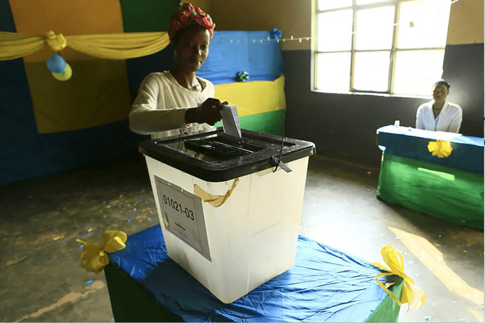 A Rwandan woman casts her vote during the December 2015 referendum to amend the Constitution to allow President Paul Kagame to seek a third term.