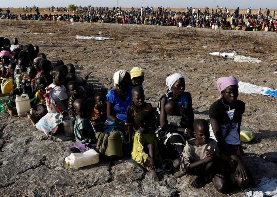 Women and children wait to be registered prior to a food distribution carried out by the United Nations World Food Programme (WFP) in Thonyor, Leer state, South Sudan, February 26, 2017. © 2017 Reuters