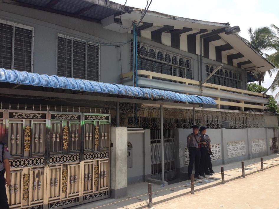 Two police officers guard one of the closed madrasas in Thaketa Township, Rangoon, after authorities inspected the building, April 29, 2017.
