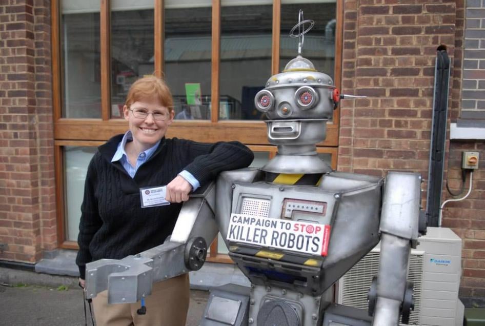 Bonnie Docherty, senior researcher at Human Rights Watch, with a “friendly robot” at the launch of the Campaign to Stop Killer Robots, April 2013. 