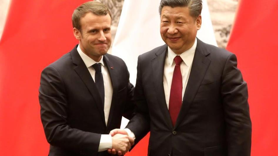 French President Emmanuel Macron (L) and Chinese President Xi Jinping (R) shake hands during a press conference in Beijing, China, January 9, 2018. 