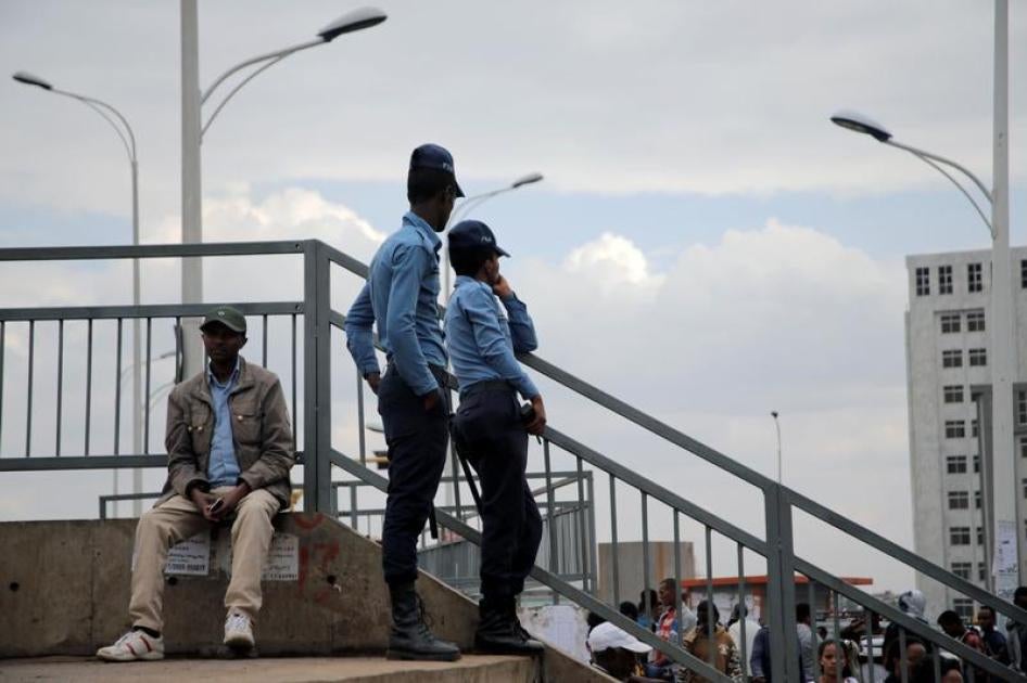 Ethiopia's police officers watch over a foot bridge as they patrol the streets of Addis Ababa, Ethiopia February 21, 2018.